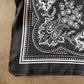 Silk scarf in black print.