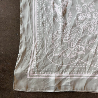 Silk scarf in pastel green print.