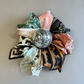 A collection of colorful patterned silk scarves. 